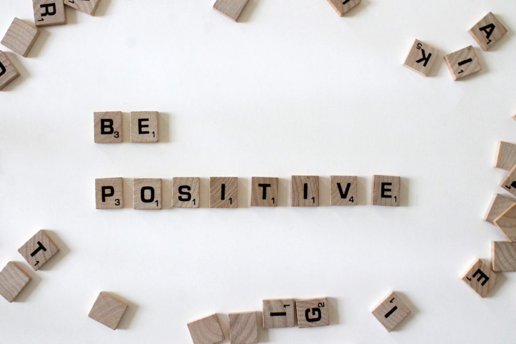 How to coach employees to think for themselves Image description: Be positive spelled out in scrabble tiles