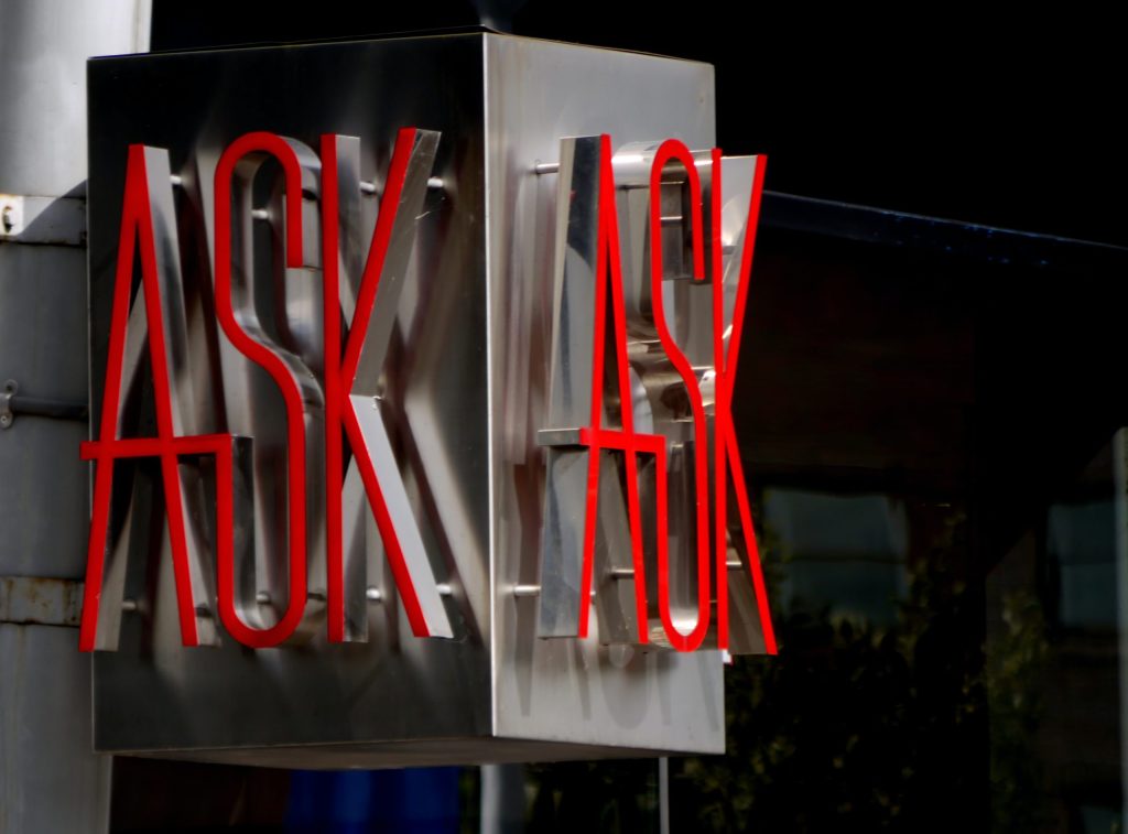 A sign that says ASK
