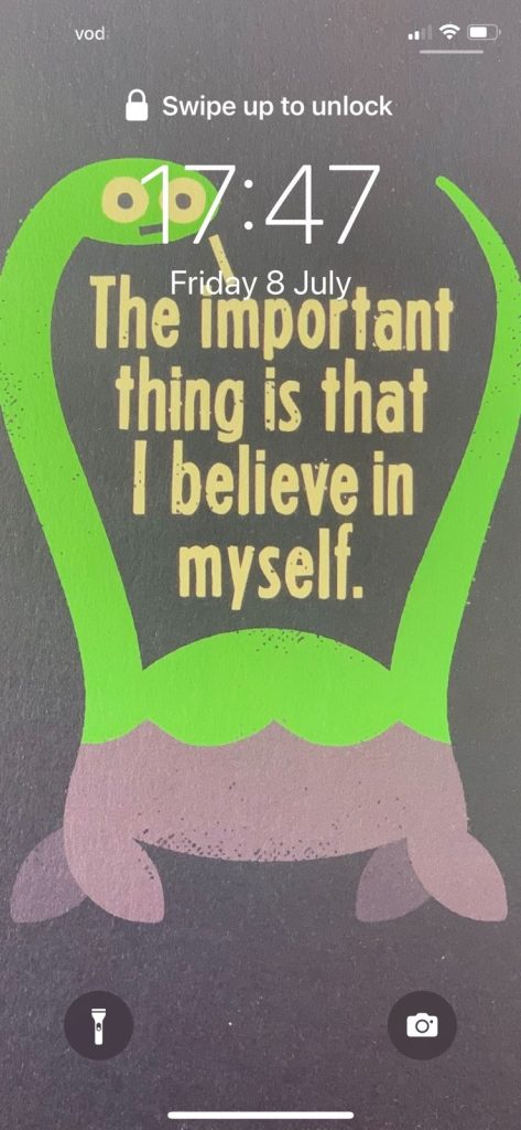 Screenshot of an iphone lock screen. The picture is of the Loch Ness Monster with text that says, "The important thing is that I believe in myself."