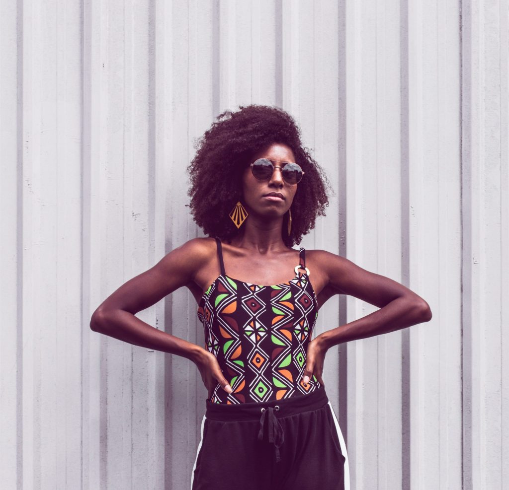 A woman standing with her hands on her hips